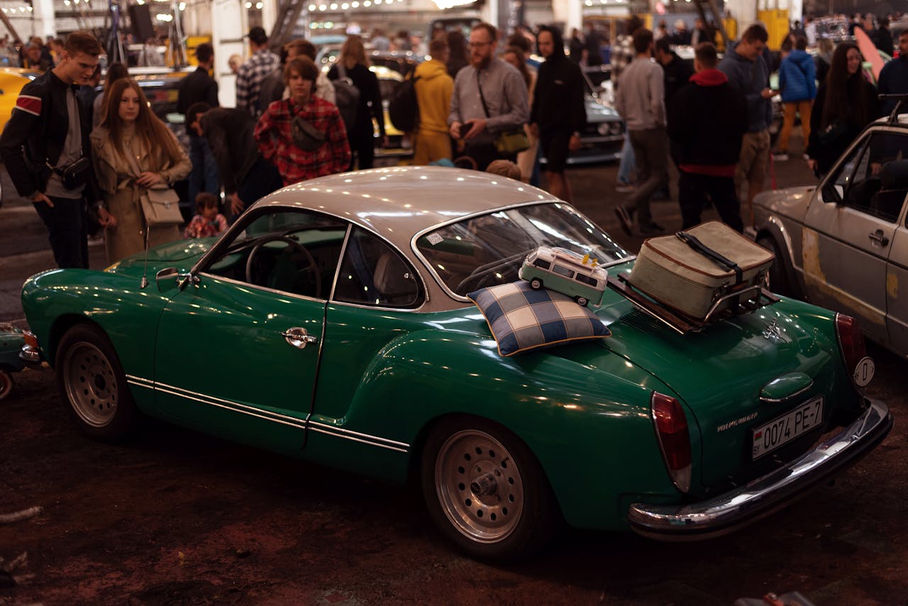 digital Classic Volkswagen at a bustling car exhibition, evoking nostalgia.