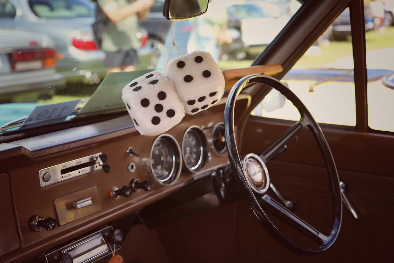 Services-03 Classic car interior featuring fuzzy dice hanging from the mirror in Busselton, Australia.
